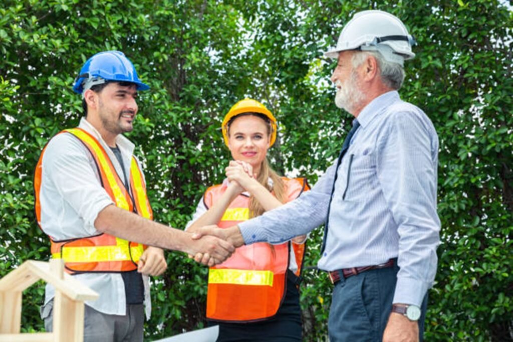 Tree trimming and pruning service in Stow with a professional crew carefully cutting tree branches near a residential property.